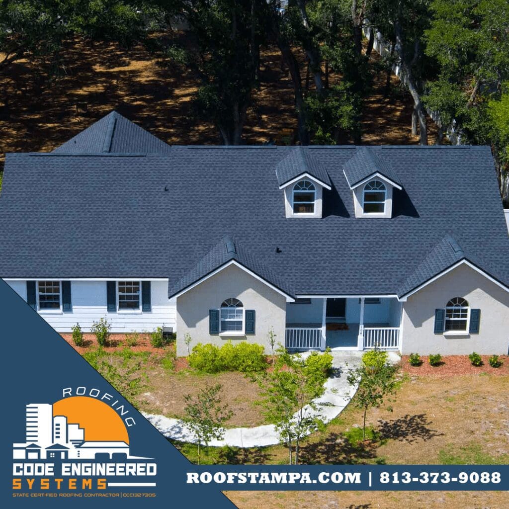 GAF Timberline HDZ Charcoal Shingles on a White House with Green Trim