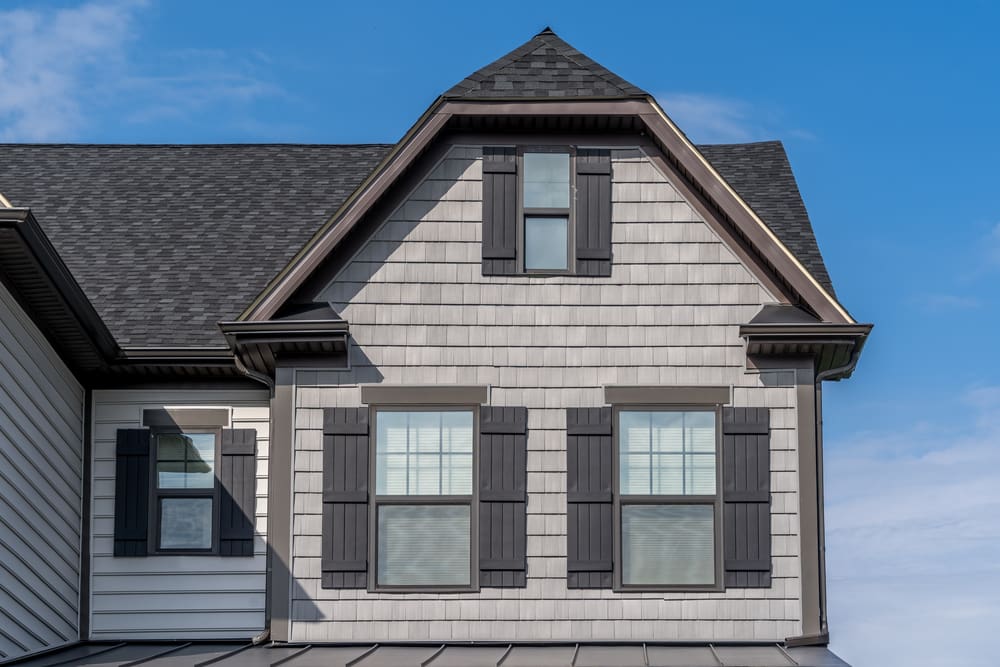 The Dutch gable roof design, known for its unique blend of traditional hip and gable roof styles, creates a striking aesthetic while offering functional benefits.