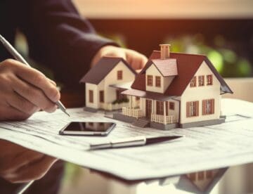 A real estate agent calculating a home's resale value.